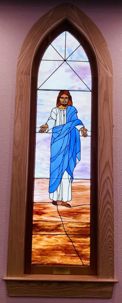 Stained glass Jesus open arms
