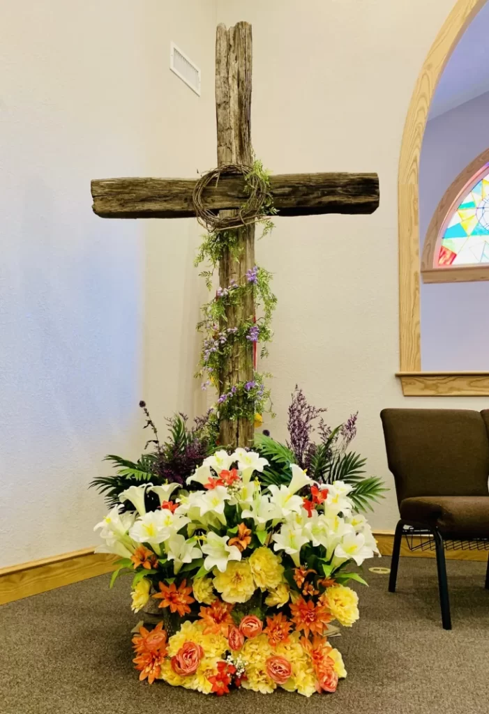 Wooden cross with flowers